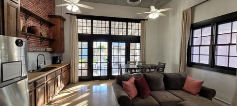 large bay doors converted into windows offers lots of light.