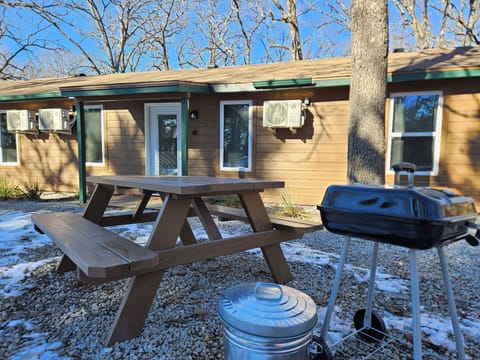 Outdoor furniture with Coal Grill and a bucket for a hot coals.
