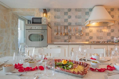 Luxury Beachfront pet friendly villa in Trogir - ground floor of the villa with kitchen, dining area, mobile grill and bathroom