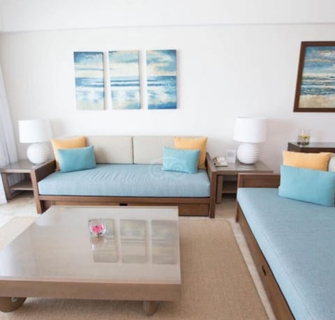 Living room with two sofa beds and each has a trundle bed.