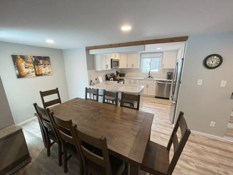 Spacious dining area with a large table — perfect for family meals, group gatherings, or après-ski dinners.