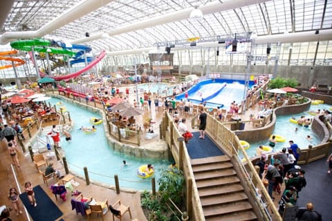 Huge Indoor Water park just steps away with features including a lazy river, water slides, hot tub, and a flow rider