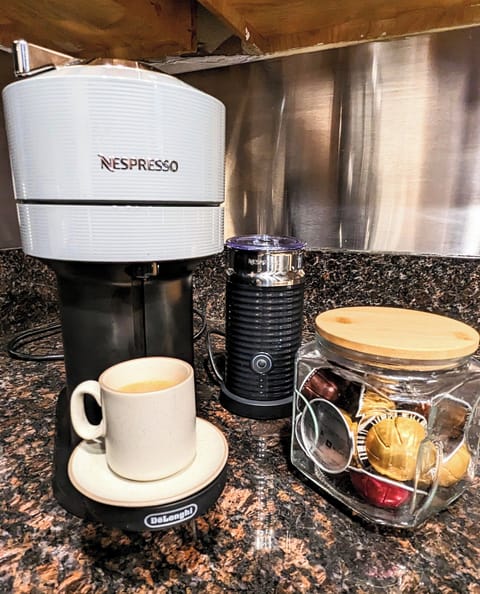 Nespresso Vertuo machine with frother, & pods to make your own coffee at home.