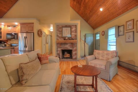 View of Entry, fireplace and living area
