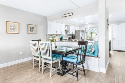 Dining area with seating for six, adjacent to the living room.