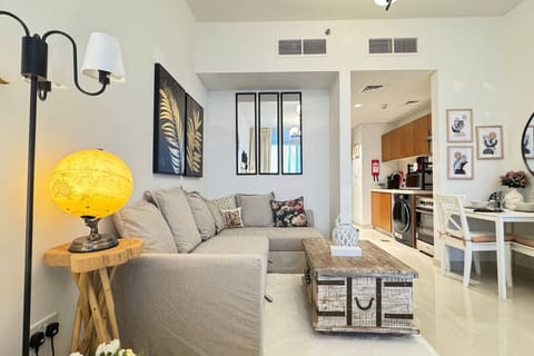 A thoughtfully crafted living area, blending comfort and functionality with a cozy sofa and bed.