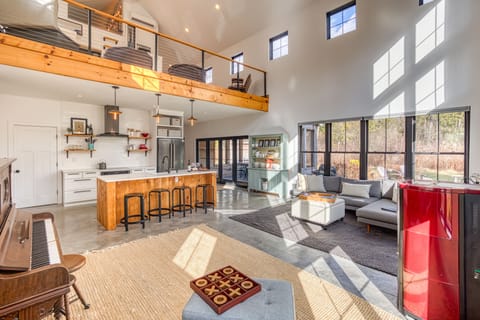 View from the corner of the living room into the kitchen, and up to the loft