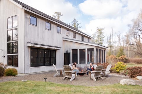 View from backyard of back of house and fire pit