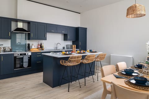 Indulge your inner chef in the elegant, fully equipped kitchen, complete with high-end appliances and everything you need to create and enjoy gourmet home-cooked meals.