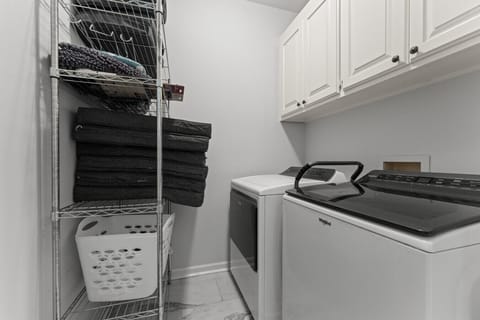 Laundry Room: Keep your outfits fresh with modern appliances and organized storage!