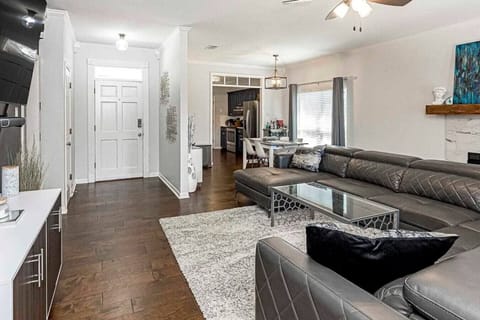 Living Room: Bright and spacious retreat with stylish decor and a view of the inviting kitchen!