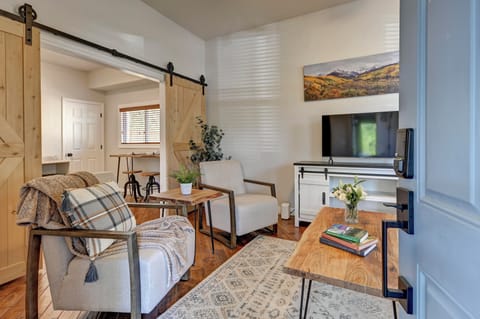 Living Room has lots of natural light, a TV with Roku Guest Mode and board games