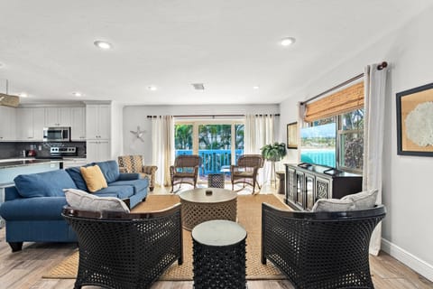 SandCastle Living Room.  In background, the sliding glass doors to the outside deck