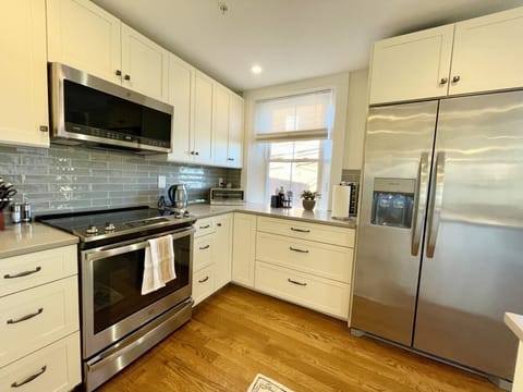 Fully equipped kitchen with everything the home cook would need. 12 piece pot and pan set, chef knives, full spice rack, toaster oven, and coffee station.