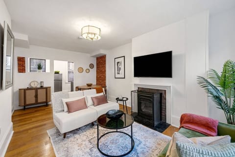 View of the smart TV and 2 sleeper chairs