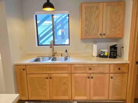 Kitchen stocked with drip coffee machine and Schiul Brand Coffee.