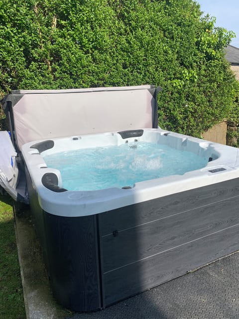 Hot tub in South facing garden. Relax, enjoy the views with a glass of wine!