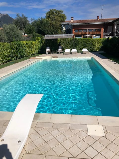 Swimming pool with diving board and diving area