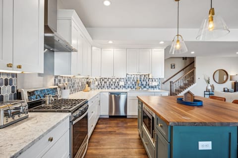 Gas burning stove and fully stocked kitchen