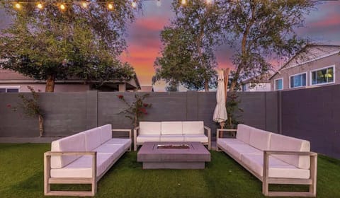 Seating area with modern sofas in the yard.