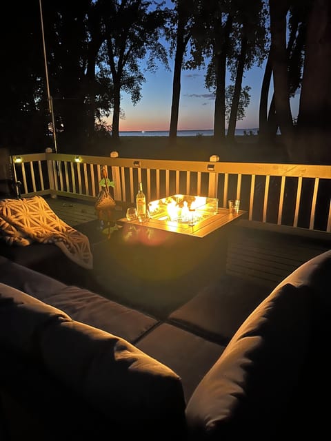 Welcoming Fire pit on Back Deck over looking the lake.