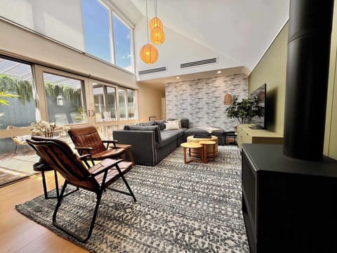 Living room with high ceiling and skylight windows