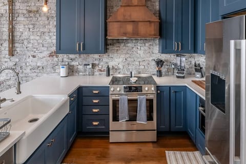 Open concept kitchen comes fully stocked with all the essentials needed to make home cooked meals