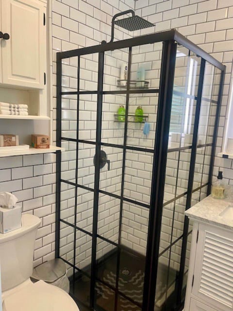A pristine private bathroom with shower