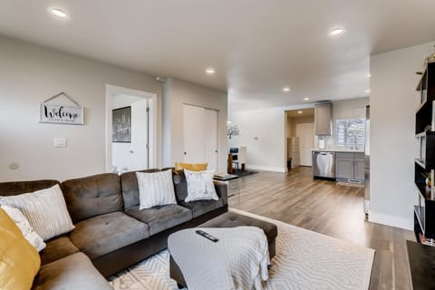 Open Concept living room that flows easily into kitchen and dining area