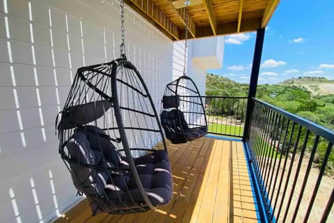 Unit 1: Relax in cozy egg swings with stunning Canyon Lake hill country views.