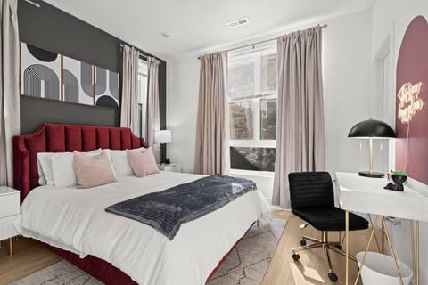 Spacious bedroom with a plush queen-size bed that comfortably sleeps 2 + dedicated workspace