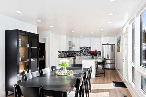 - Modern kitchen with stainless steel appliances and bright cabinetry  
- Dining table for shared meals with mountain views nearby  
- Sleek backsplash and island perfect for cooking and gathering