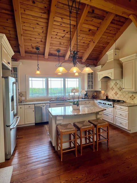 Large, well-stocked kitchen with beautiful lake view