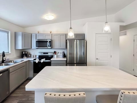 Full kitchen with island with coffee and drip coffee maker