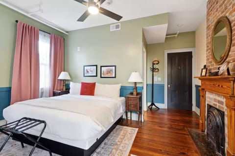 Bright primary bedroom with a king bed and plenty of room to relax, as well as an attached full bathroom.