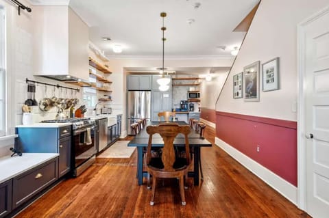 Fully equipped kitchen with a dining table, full set of appliances, and all the cookware, dishes, and utensils you need to prepare meals with ease.