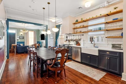 Fully equipped kitchen with a dining table, full set of appliances, and all the cookware, dishes, and utensils you need to prepare meals with ease.