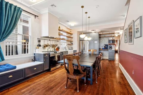 Fully equipped kitchen with a dining table, full set of appliances, and all the cookware, dishes, and utensils you need to prepare meals with ease.