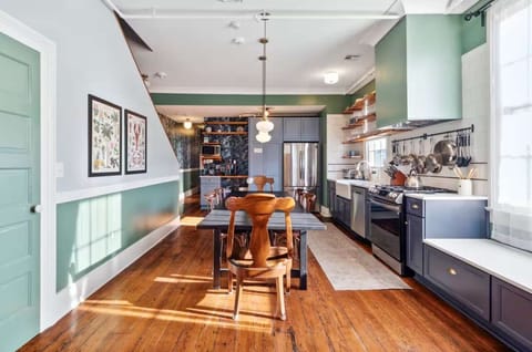 Bright and inviting kitchen with a dining table, full set of appliances, and all the cookware, dishes, and utensils you need to prepare meals with ease.