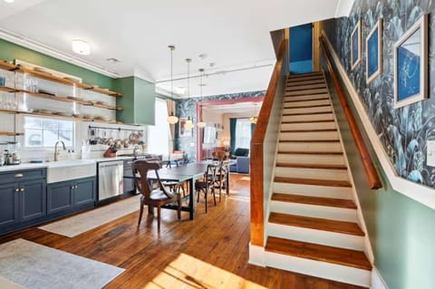 View of the kitchen with the staircase leading to the large upstairs bedroom. (Right side unit)
