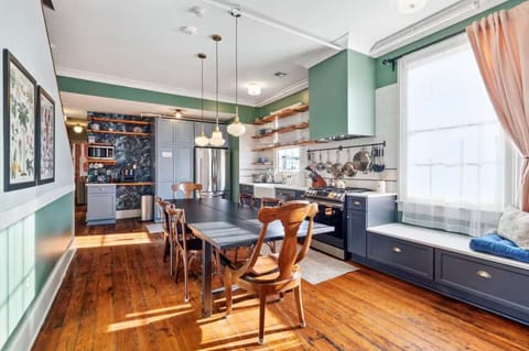 Bright and inviting kitchen with a dining table, full set of appliances, and all the cookware, dishes, and utensils you need to prepare meals with ease. (Right side unit)