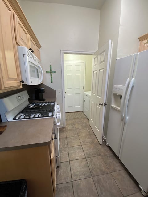 Kitchen to washer/dryer entry to Garage