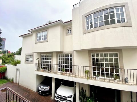Main view of the house with garage and outside door to the garden