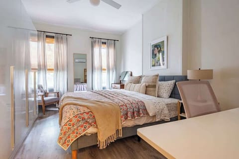 Welcome to your spacious oasis with king sized bed. The comfiest bed ever with high thread count quality linens. You won't want to get out of bed! Your room has plenty of seating options with an accent chair, side table, vanity with bench. 