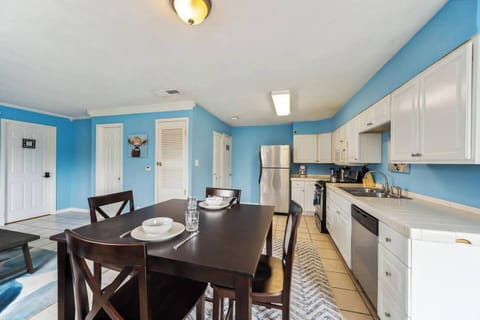 Bright kitchen & dining area with full-size appliances and seating