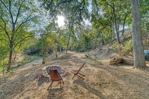 Private wooded backyard with fire pit seating