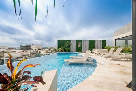 Shared rooftop pool paradise! Soak up the sun & ocean views.