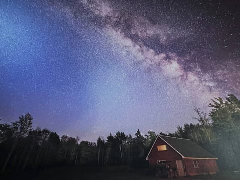 Milky Way sky over cabin