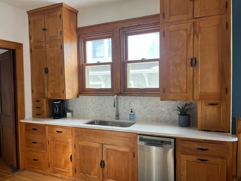 Kitchen- new quartz countertop, new sink and appliances.