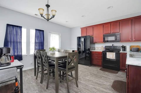 Dining Area: Cook and dine in style in this modern kitchen and cozy dining space.